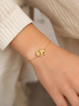 Damenarmband mit goldenem Anhänger Babyfüßchen