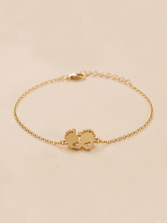 Damenarmband mit goldenem Anhänger Babyfüßchen